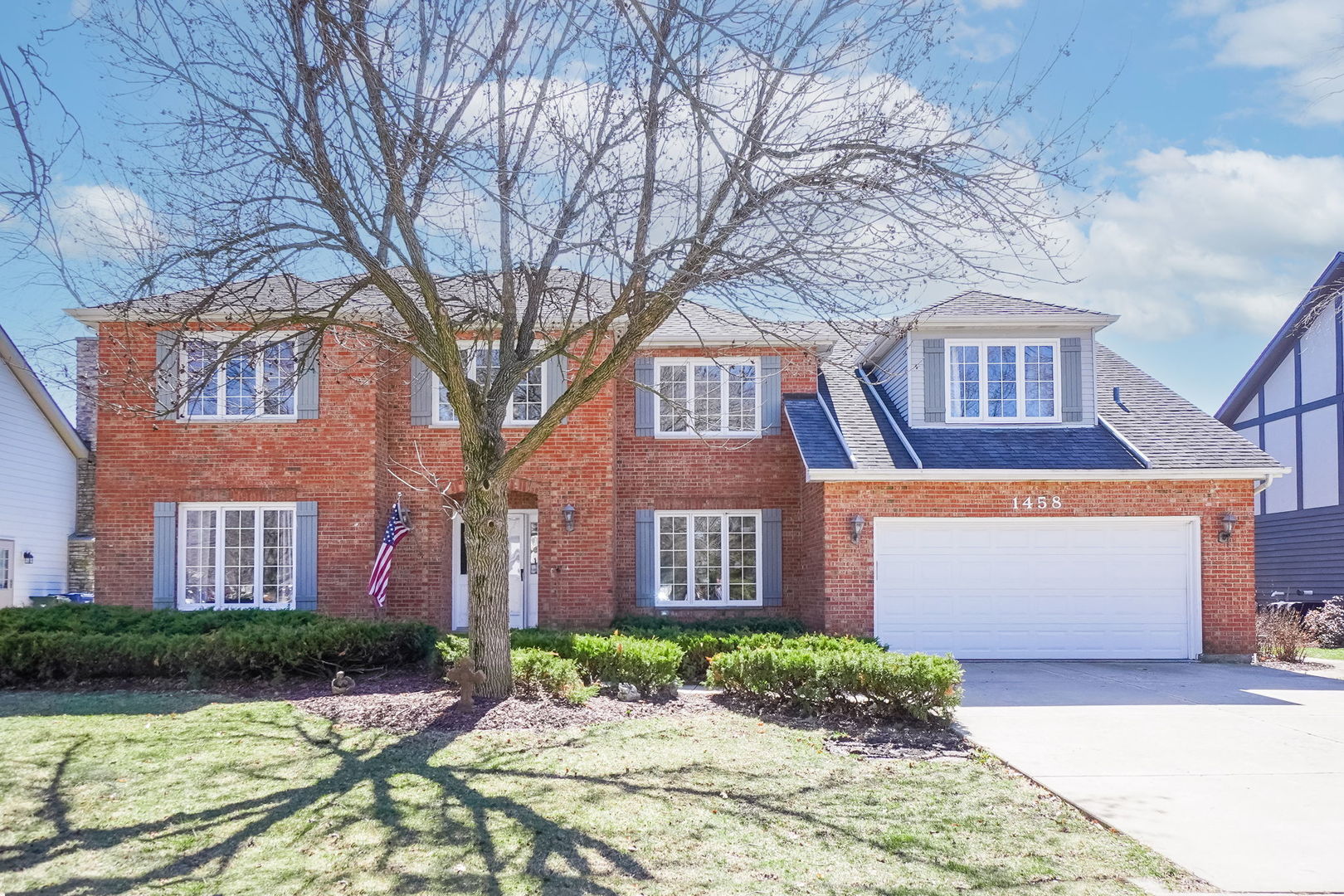 1458 Lantern Circle Naperville, IL 60540 - Photo 1 of 1 a front view of a brick house with a yard