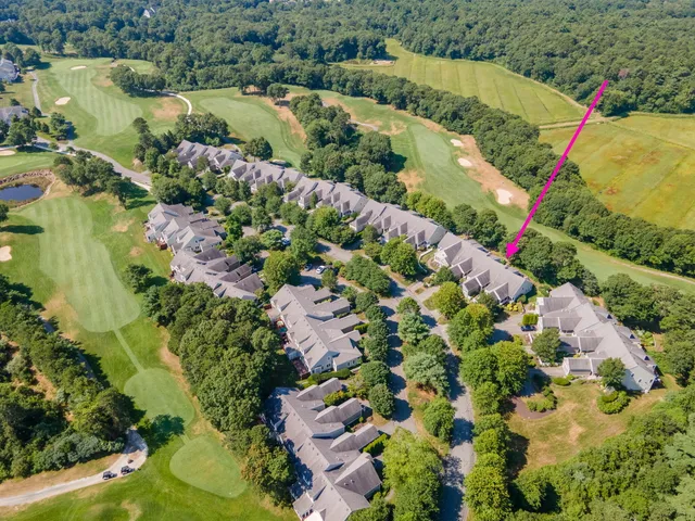an aerial view of residential house with outdoor space and swimming pool