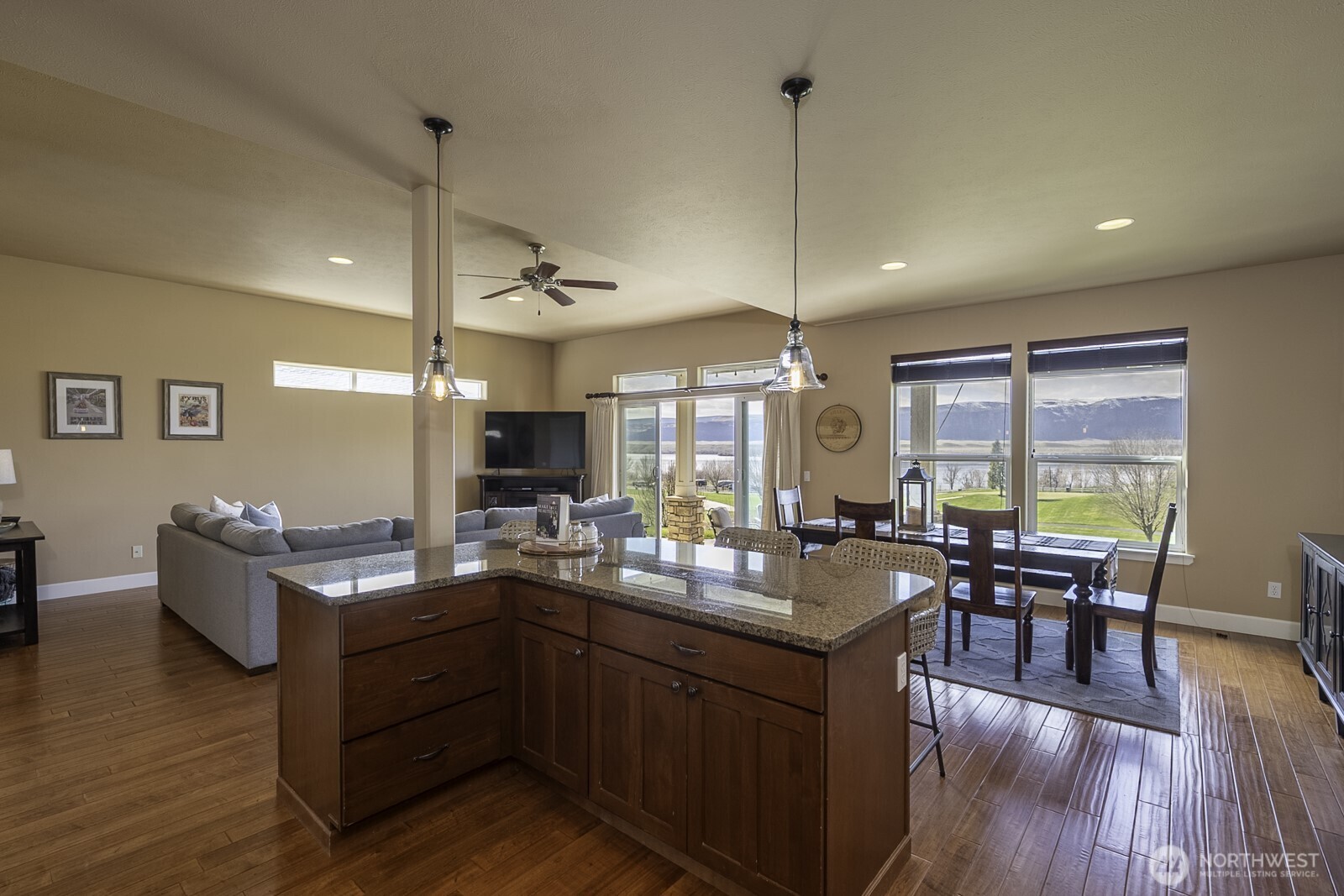 23466 Sunserra Loop Quincy, WA 98848 - Photo 11 of 40 a very nice looking dining room with wooden floor and furniture