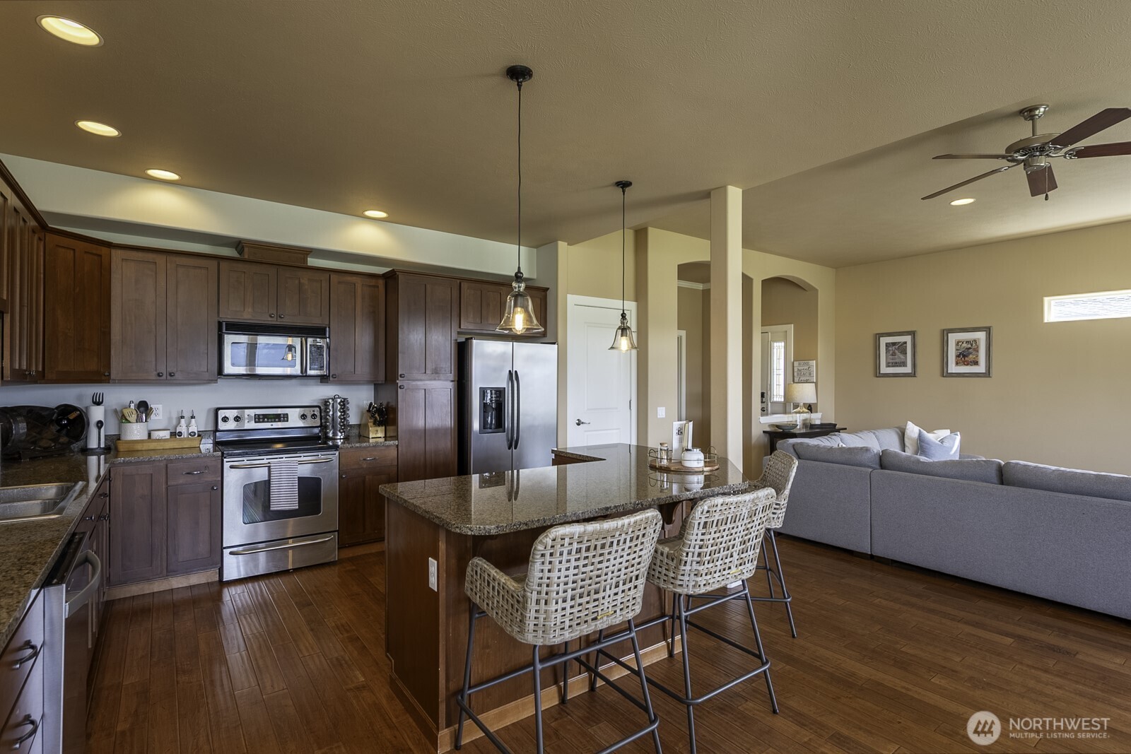23466 Sunserra Loop Quincy, WA 98848 - Photo 12 of 40 a living room with fireplace furniture and a wooden floor