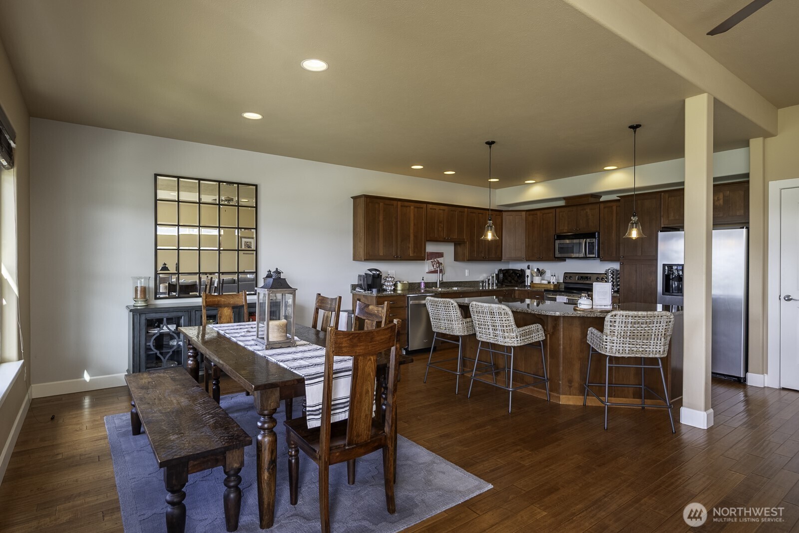 23466 Sunserra Loop Quincy, WA 98848 - Photo 15 of 40 a view of a dining room with furniture window and wooden floor