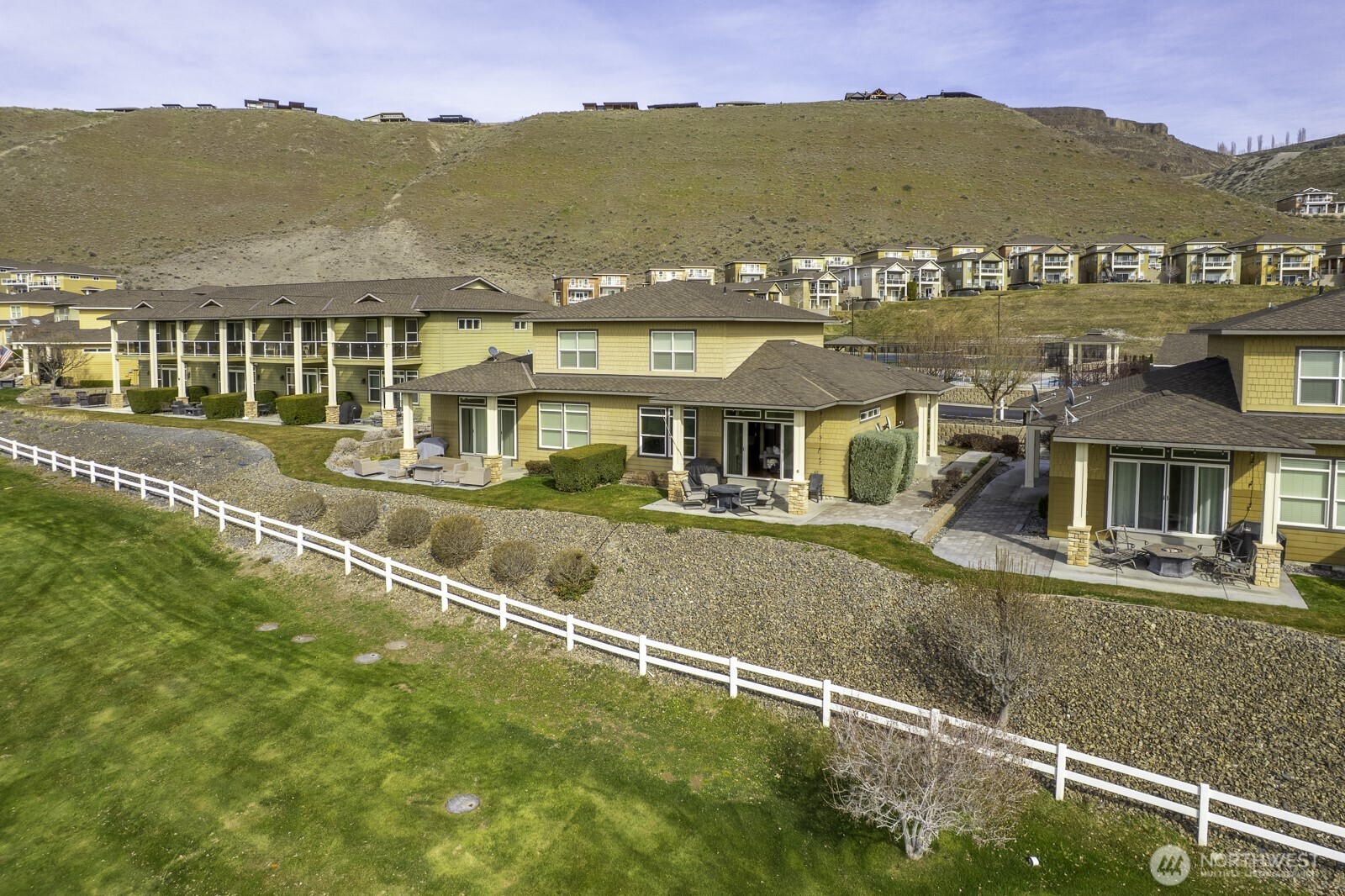 23466 Sunserra Loop Quincy, WA 98848 - Photo 2 of 40 an aerial view of residential houses with city street and mountain view