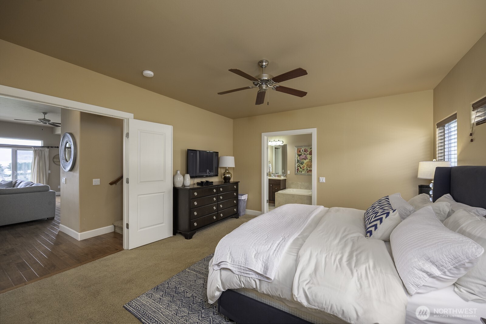 23466 Sunserra Loop Quincy, WA 98848 - Photo 21 of 40 a bedroom with a bed and a flat screen tv
