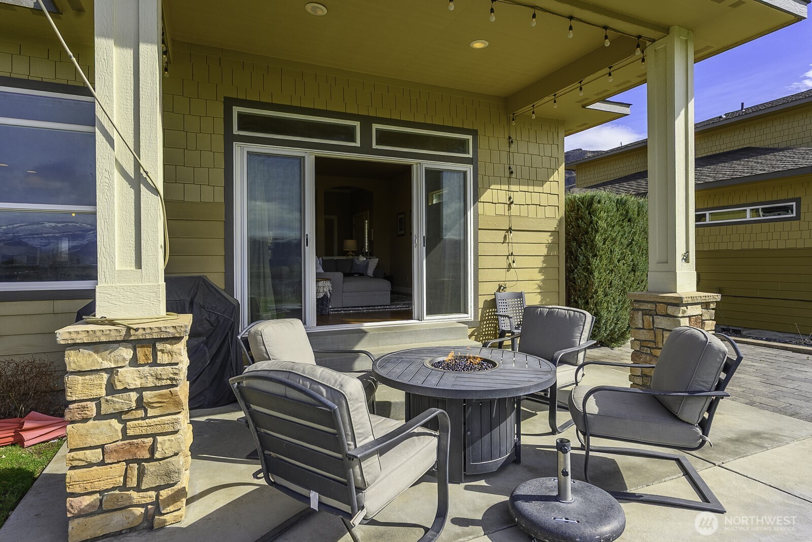 23466 Sunserra Loop Quincy, WA 98848 - Photo 32 of 40 a outdoor space with patio the couches and a dining table with garden view
