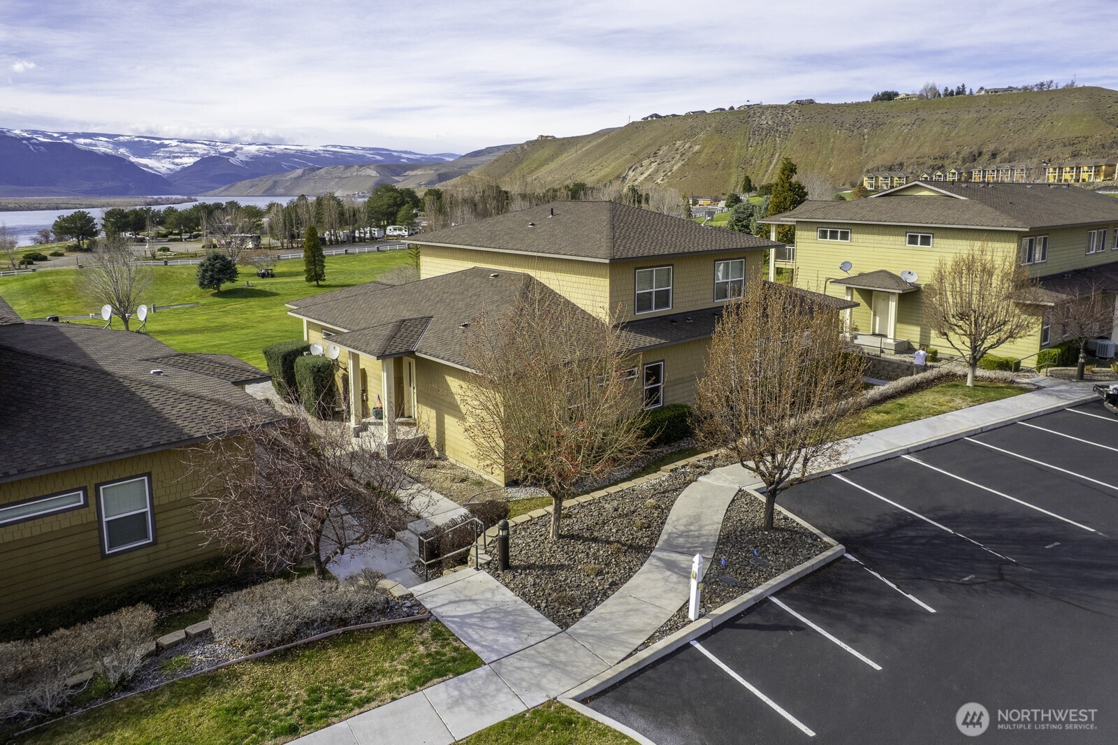 23466 Sunserra Loop Quincy, WA 98848 - Photo 10 of 40 an aerial view of a house with a yard pool outdoor seating and mountain view