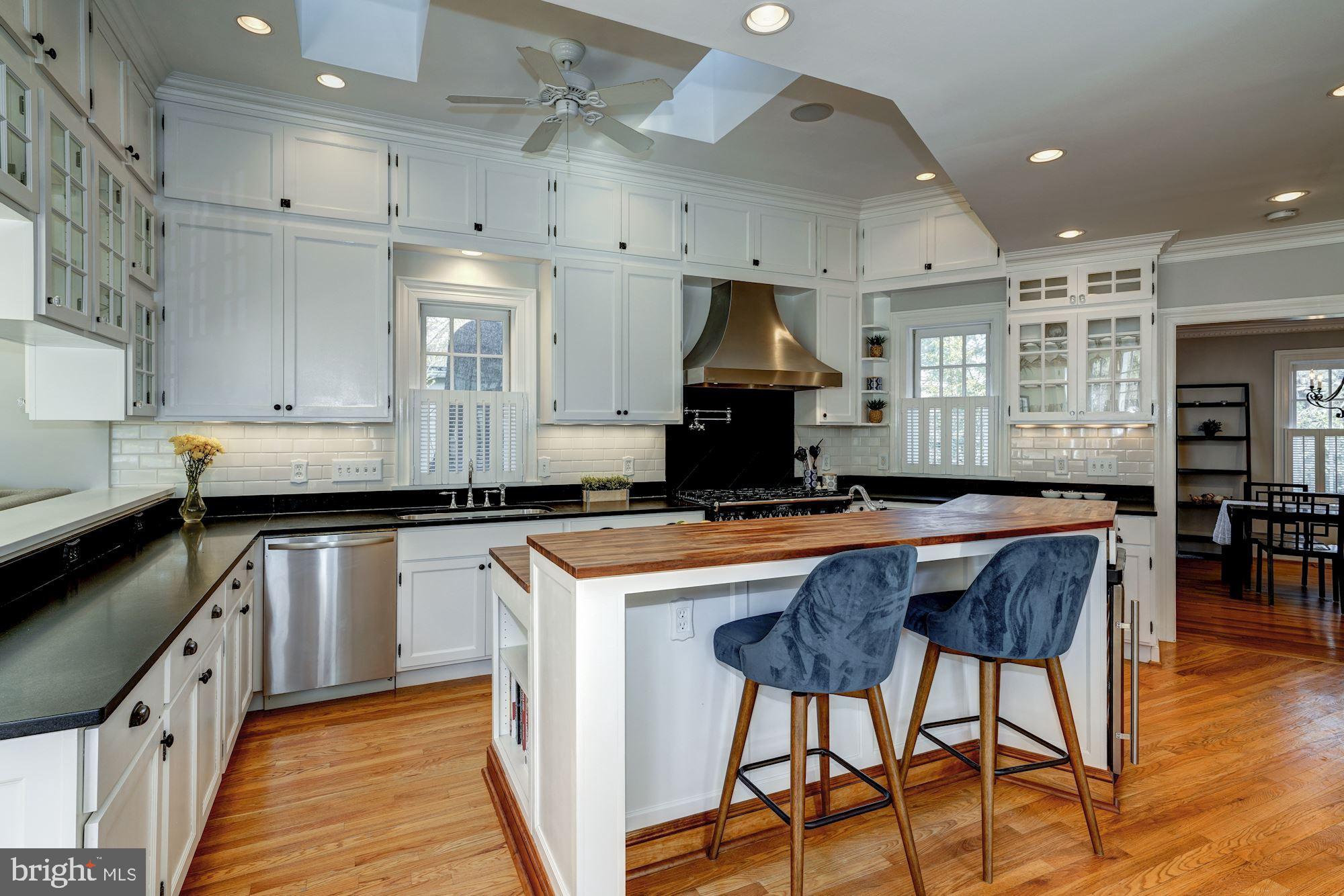 312 Rucker Place Alexandria, VA 22301 - Photo 14 of 39 Breakfast island, custom cabinets, honed counters
