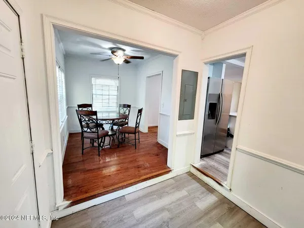 a view of a livingroom with furniture and a window