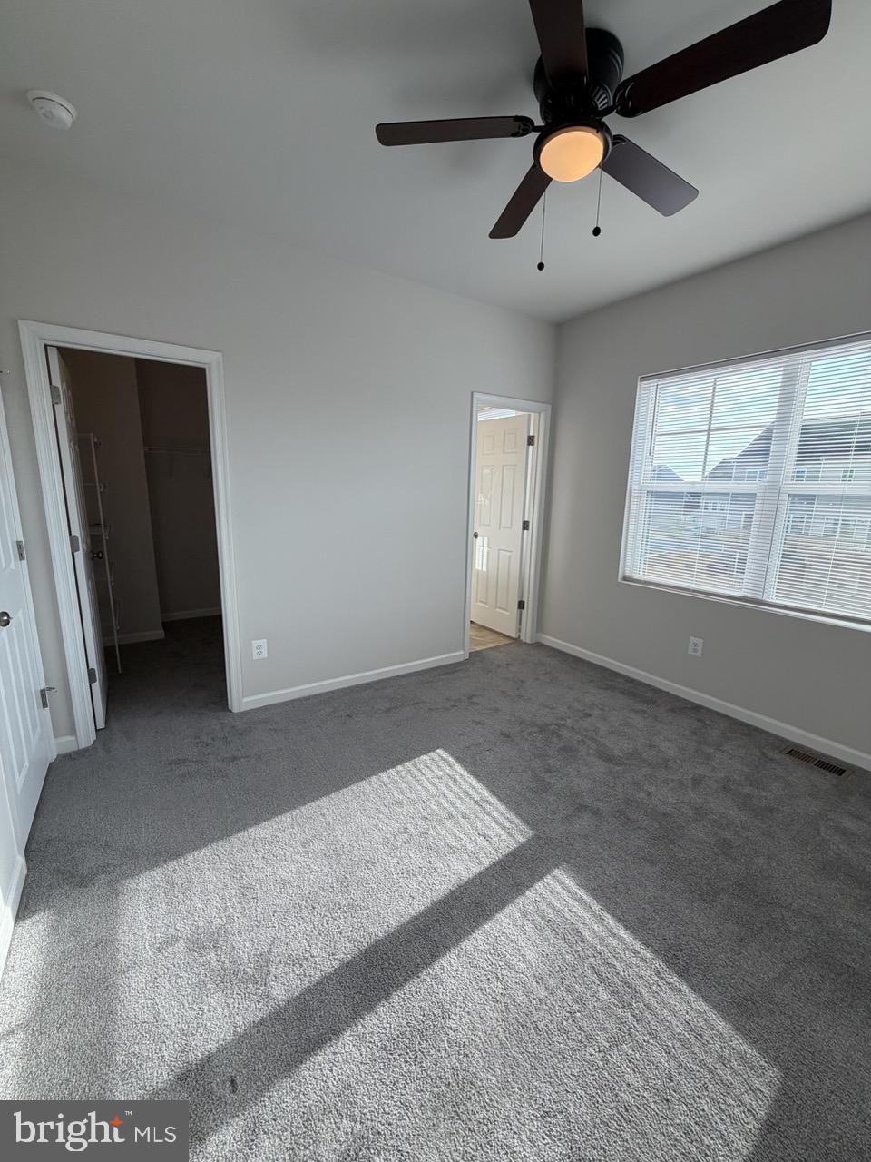 146 Galaxy Place Stephenson, VA 22656 - Photo 27 of 46 an empty room with chandelier fan and windows