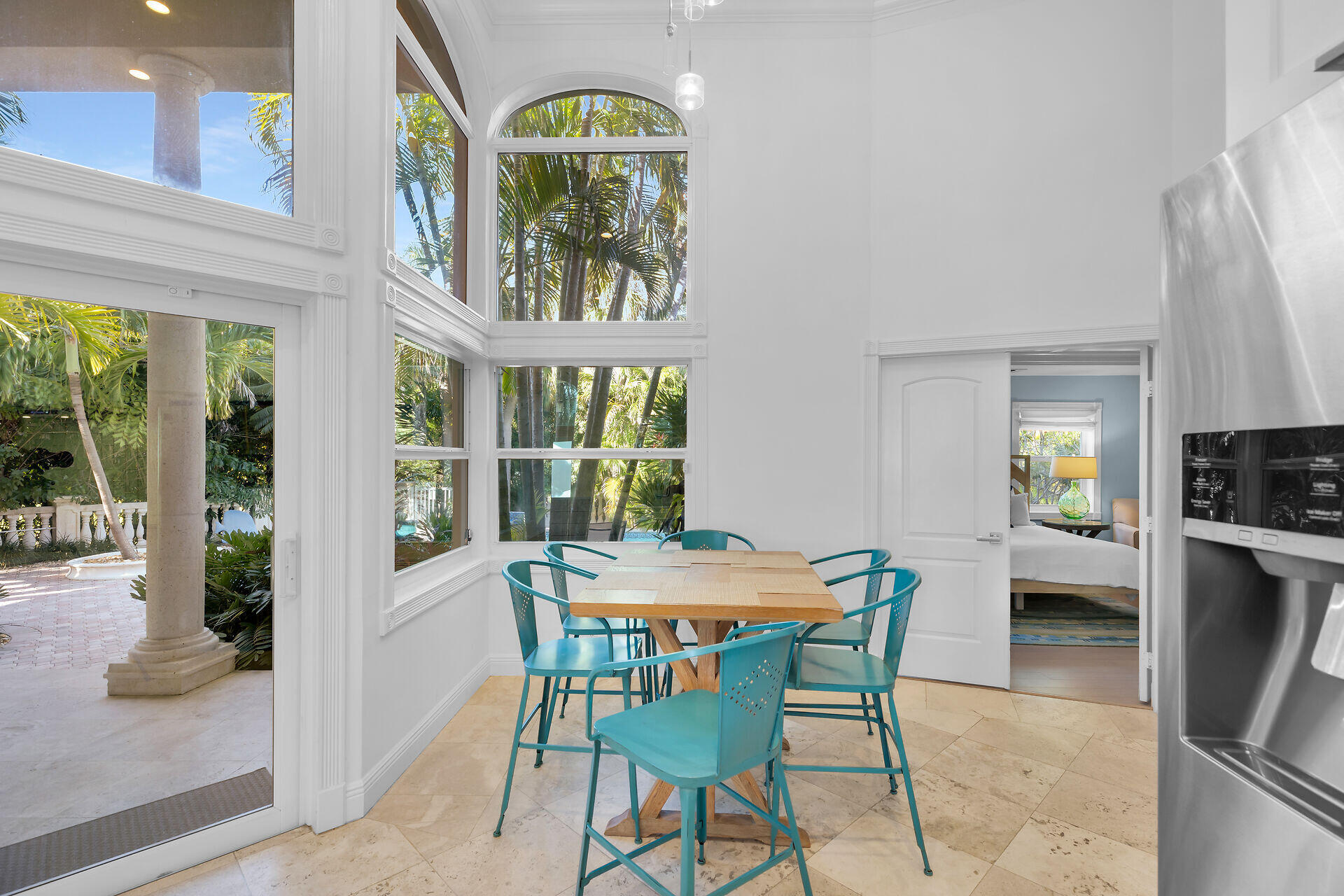 125 13th Street Key Colony Beach, FL 33051 - Photo 14 of 56 a view of a dining room with furniture large windows and wooden floor