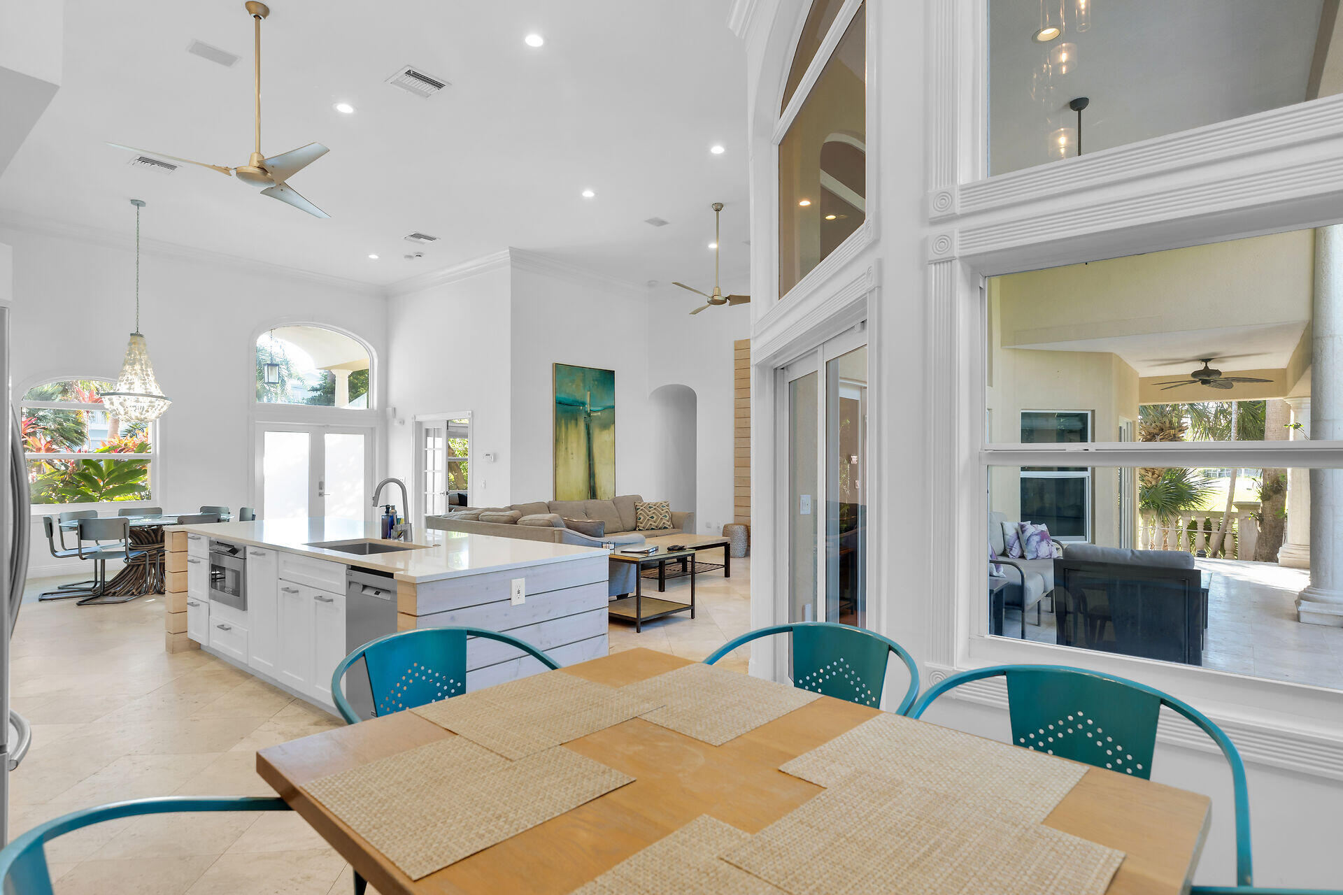 125 13th Street Key Colony Beach, FL 33051 - Photo 15 of 56 a large kitchen with cabinets table and chairs