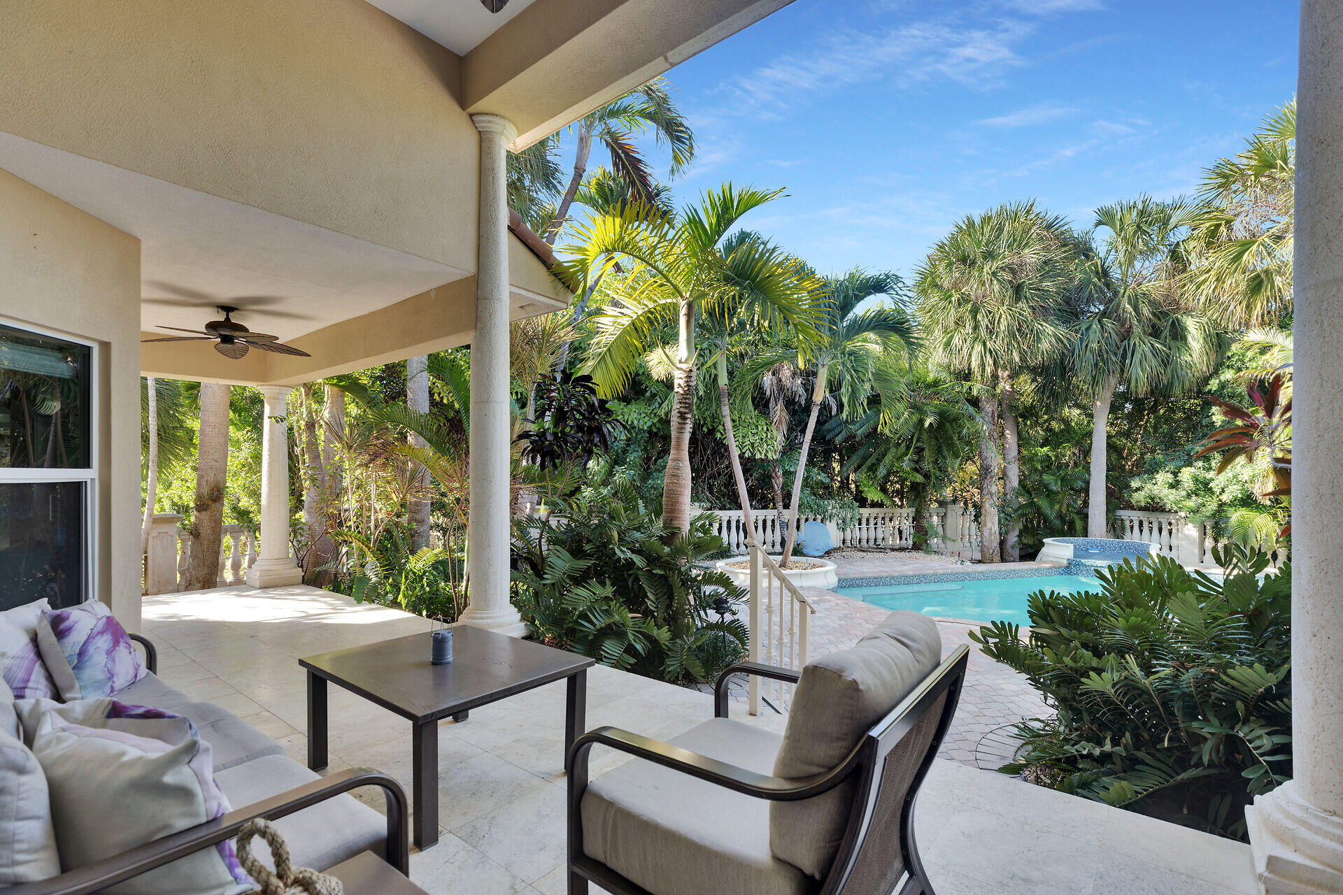 125 13th Street Key Colony Beach, FL 33051 - Photo 16 of 56 a view of a patio with table and chairs and potted plants