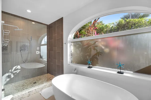 a bathroom with a sink a mirror and a bathtub