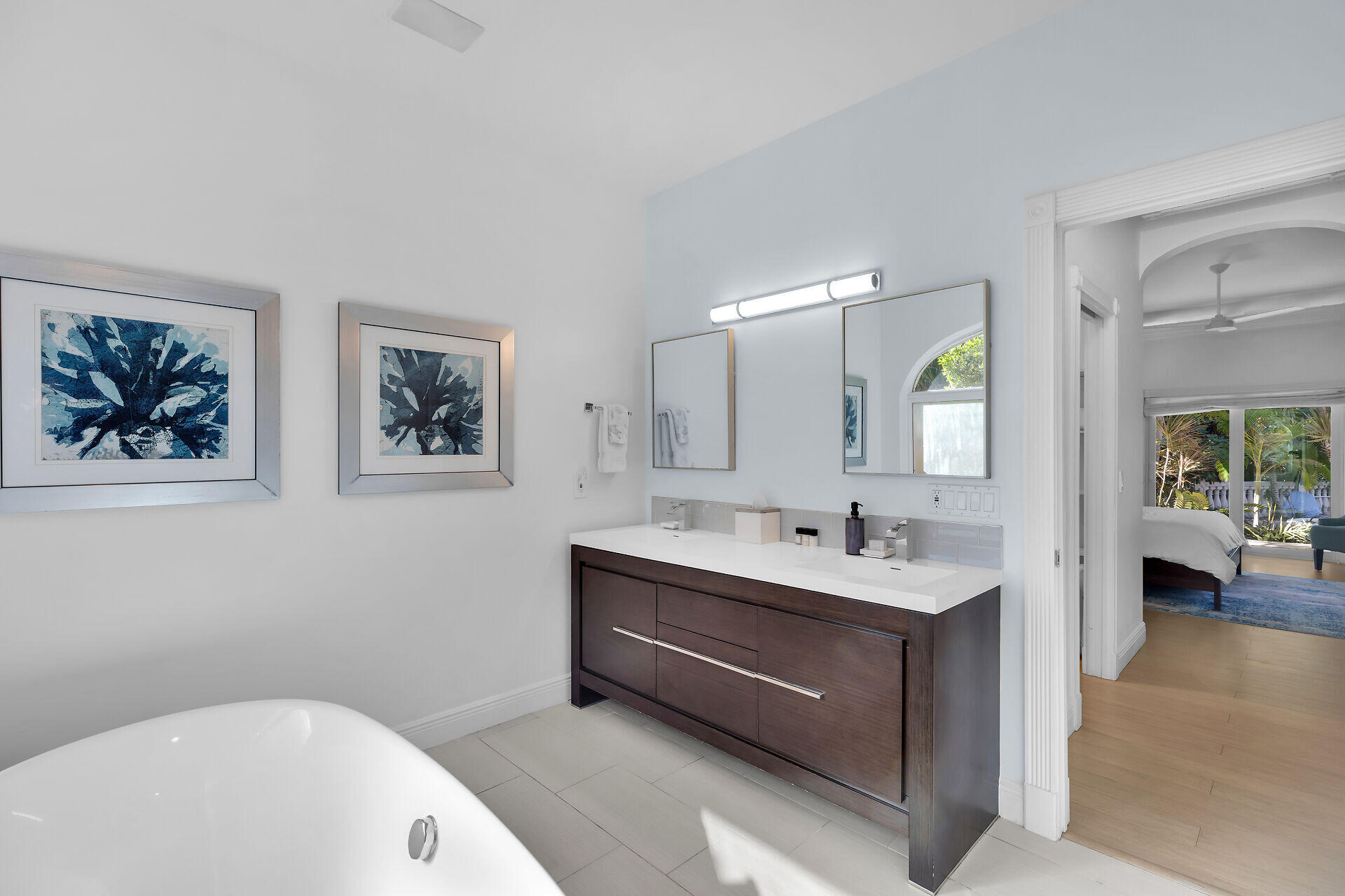 125 13th Street Key Colony Beach, FL 33051 - Photo 29 of 56 a bathroom with a sink a mirror and a bathtub