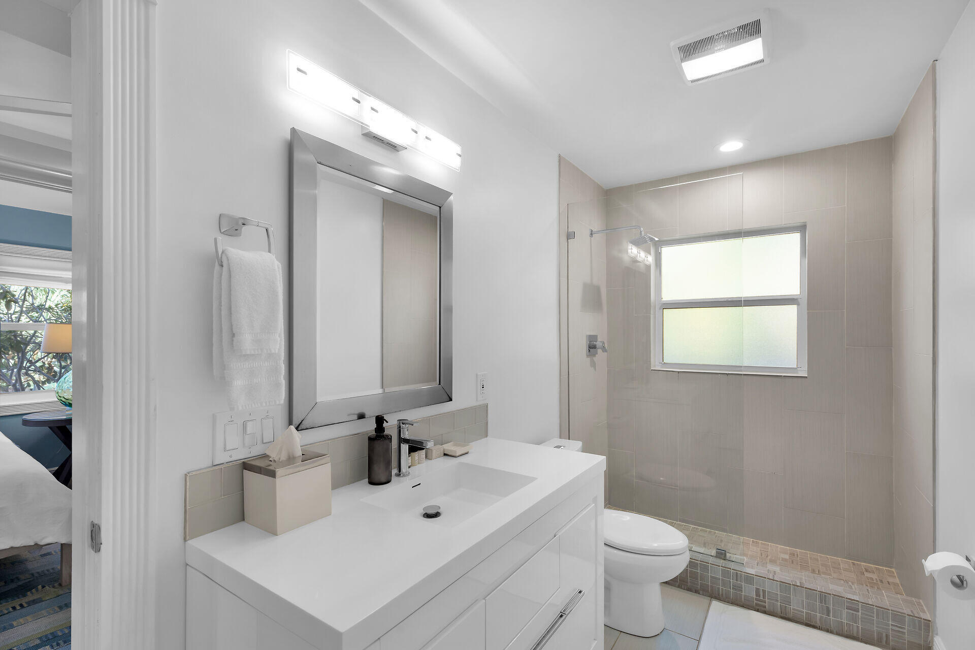 125 13th Street Key Colony Beach, FL 33051 - Photo 34 of 56 a bathroom with a sink toilet and mirror