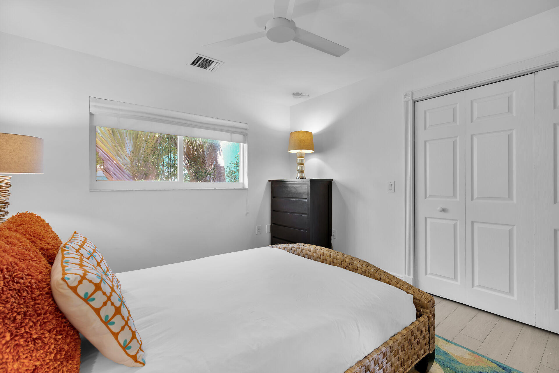 125 13th Street Key Colony Beach, FL 33051 - Photo 36 of 56 a bedroom with a bed and wooden floor