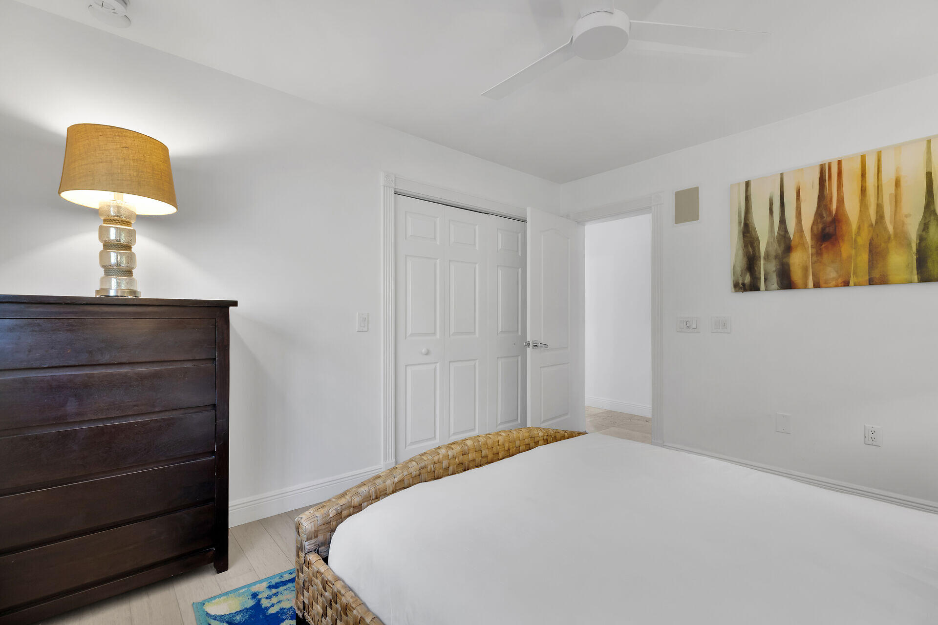 125 13th Street Key Colony Beach, FL 33051 - Photo 37 of 56 a bedroom with a bed and a lamp on dresser