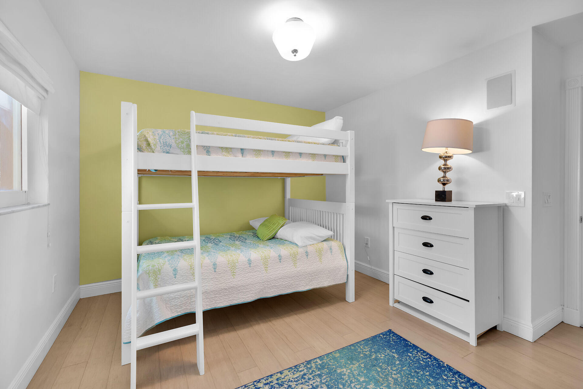 125 13th Street Key Colony Beach, FL 33051 - Photo 41 of 56 a bedroom with a bed and a window