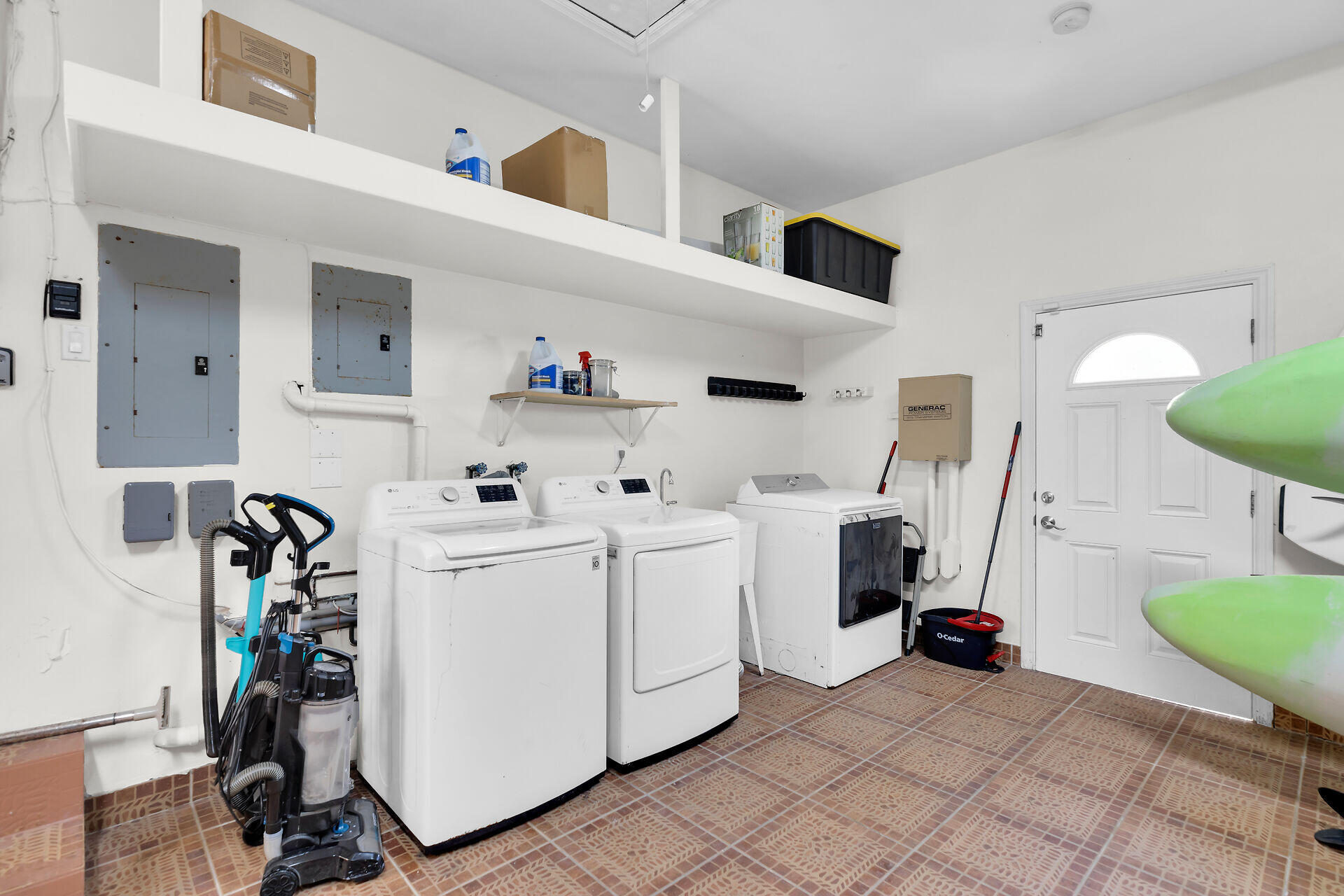 125 13th Street Key Colony Beach, FL 33051 - Photo 44 of 56 a utility room with cabinets dryer and washer