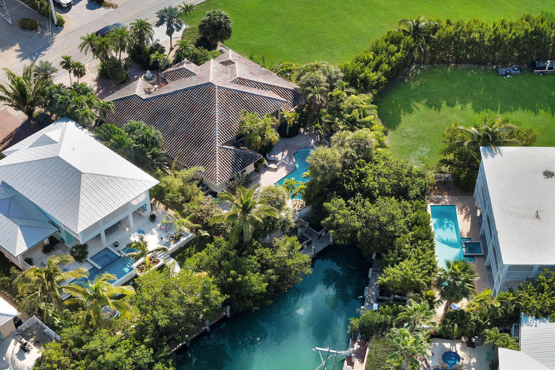 125 13th Street Key Colony Beach, FL 33051 - Photo 50 of 56 an aerial view of a house with a garden and lake view
