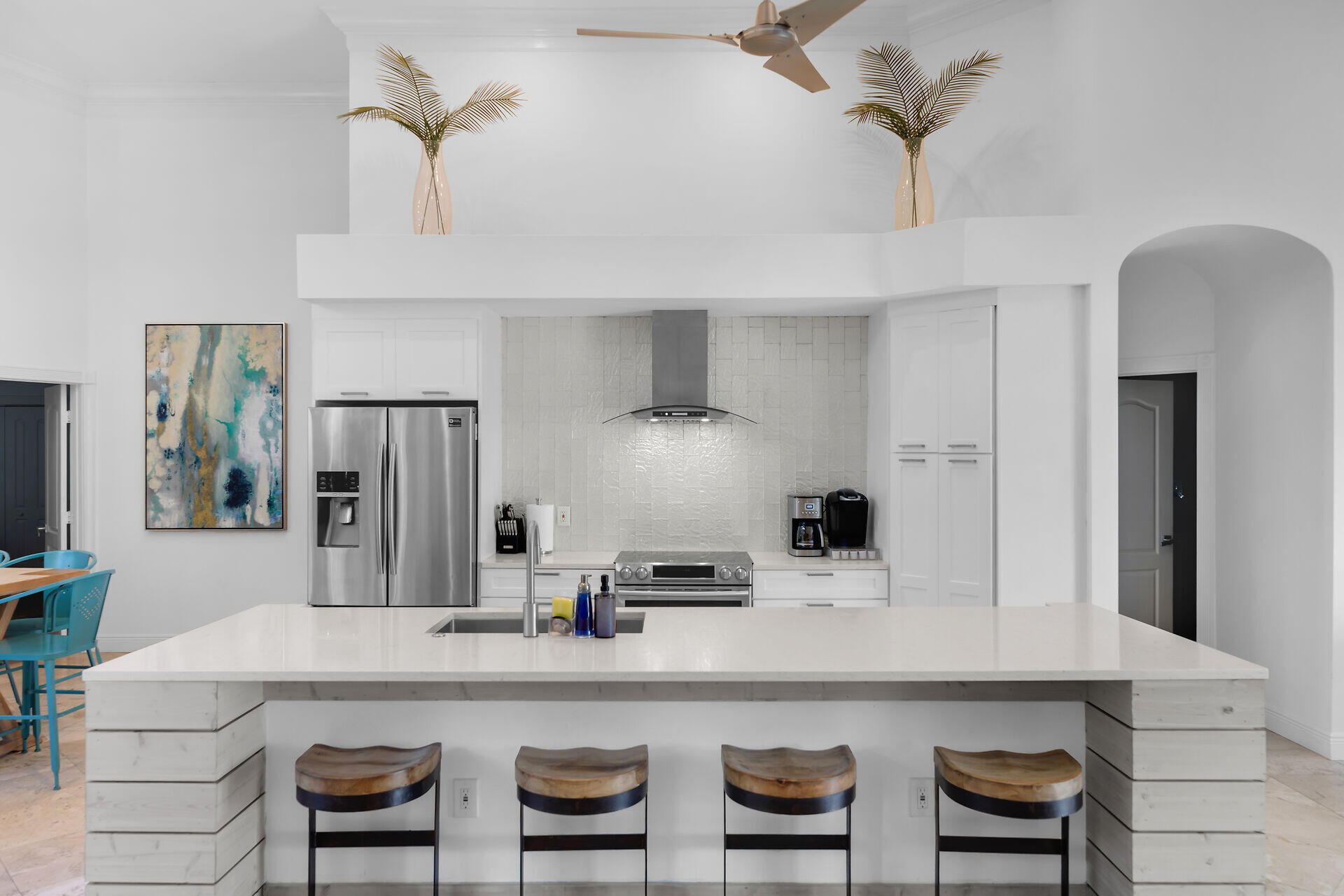 125 13th Street Key Colony Beach, FL 33051 - Photo 9 of 56 a kitchen with kitchen island stainless steel appliances a table and chairs