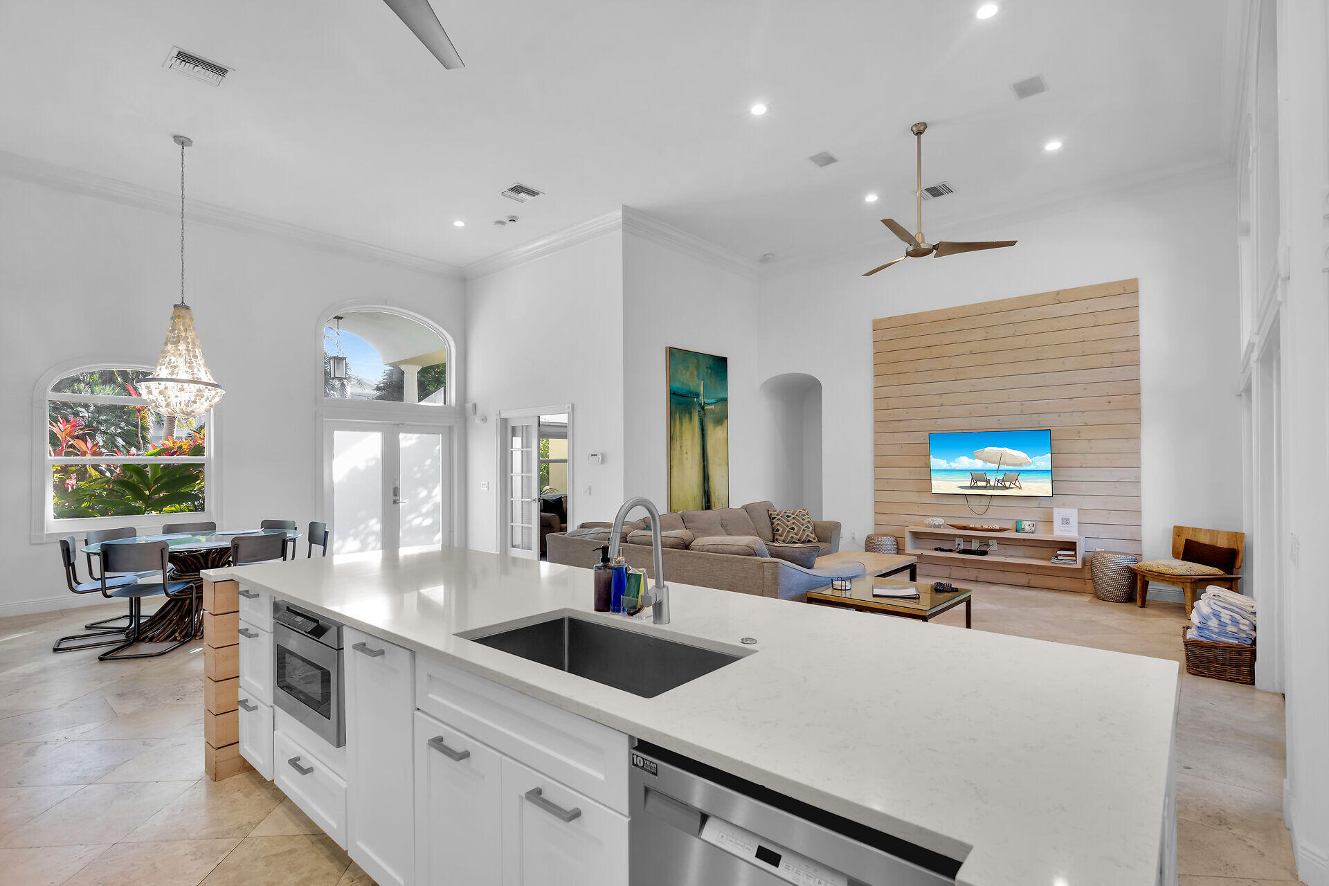 125 13th Street Key Colony Beach, FL 33051 - Photo 10 of 56 a large kitchen with a large counter top space a sink stainless steel appliances and furniture