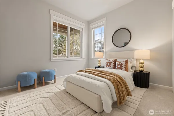 a bathroom with a granite countertop sink mirror vanity and toilet