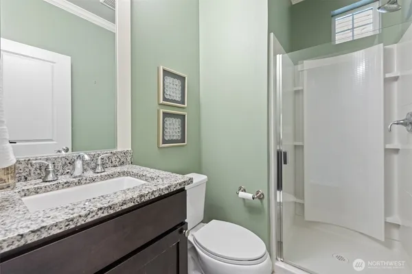 a bedroom with a bed and a couch