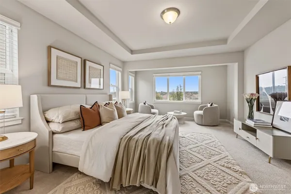 a bedroom with a large bed and a large window