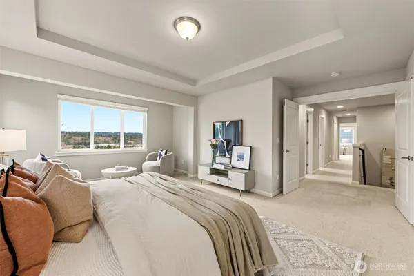 a spacious bathroom with a granite countertop sink mirror and bathtub