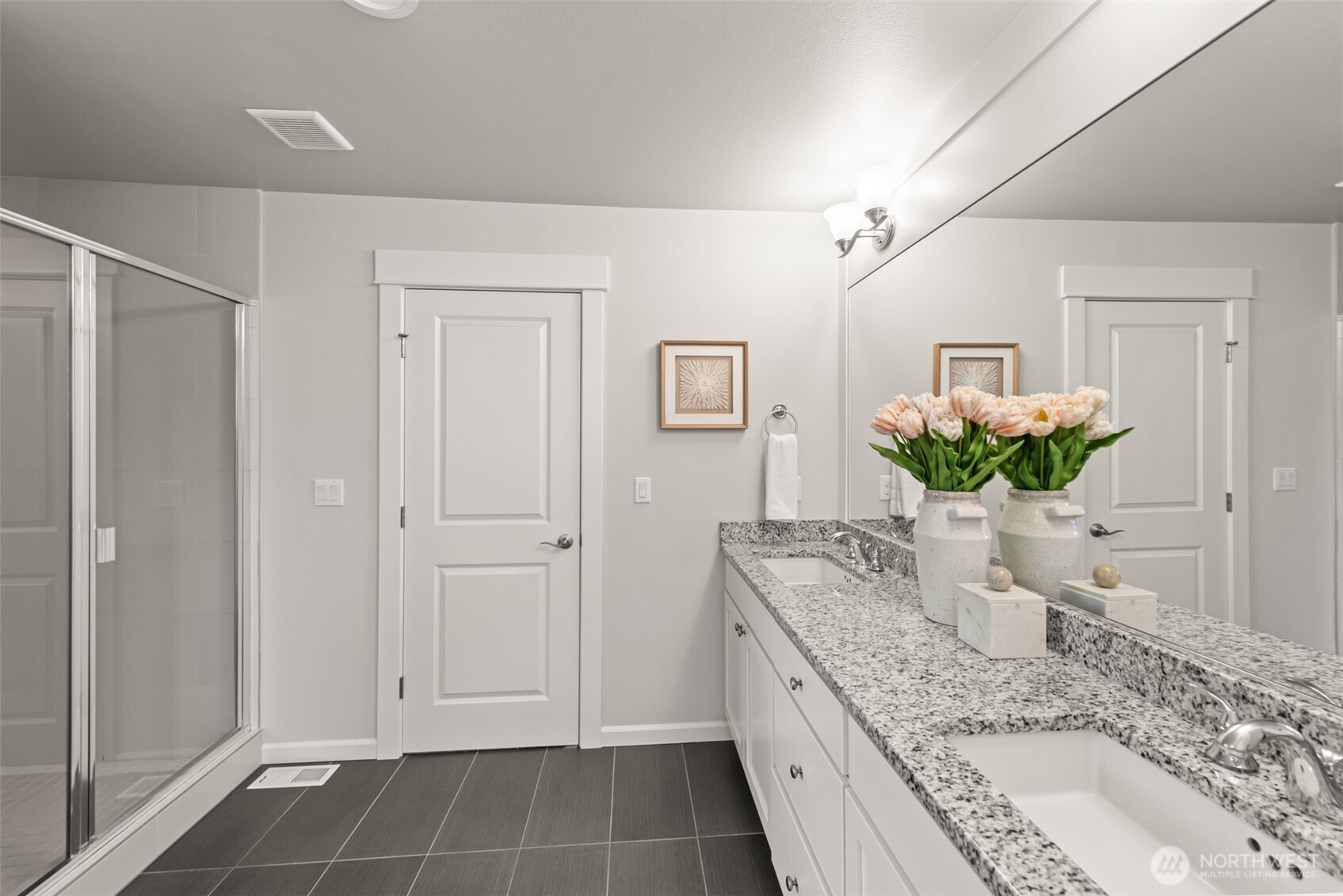 19420 109th Court Northeast Bothell, WA 98011 - Photo 18 of 35 a spacious bathroom with a granite countertop sink a mirror and a shower