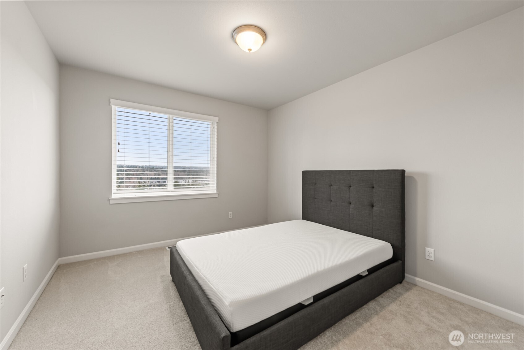 19420 109th Court Northeast Bothell, WA 98011 - Photo 23 of 35 a bedroom with a bed and window