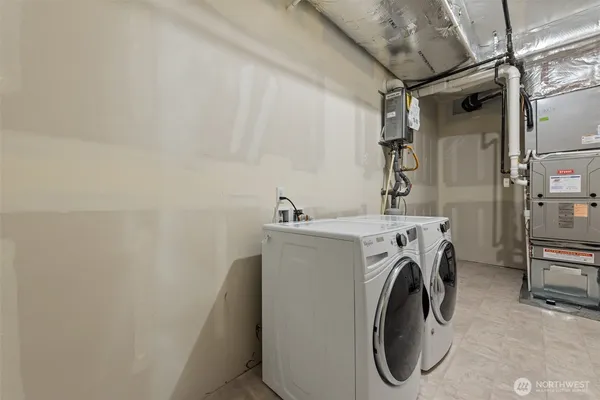 a view of a fountain in front of a house with a big yard