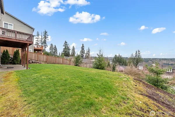 a view of a backyard of the house