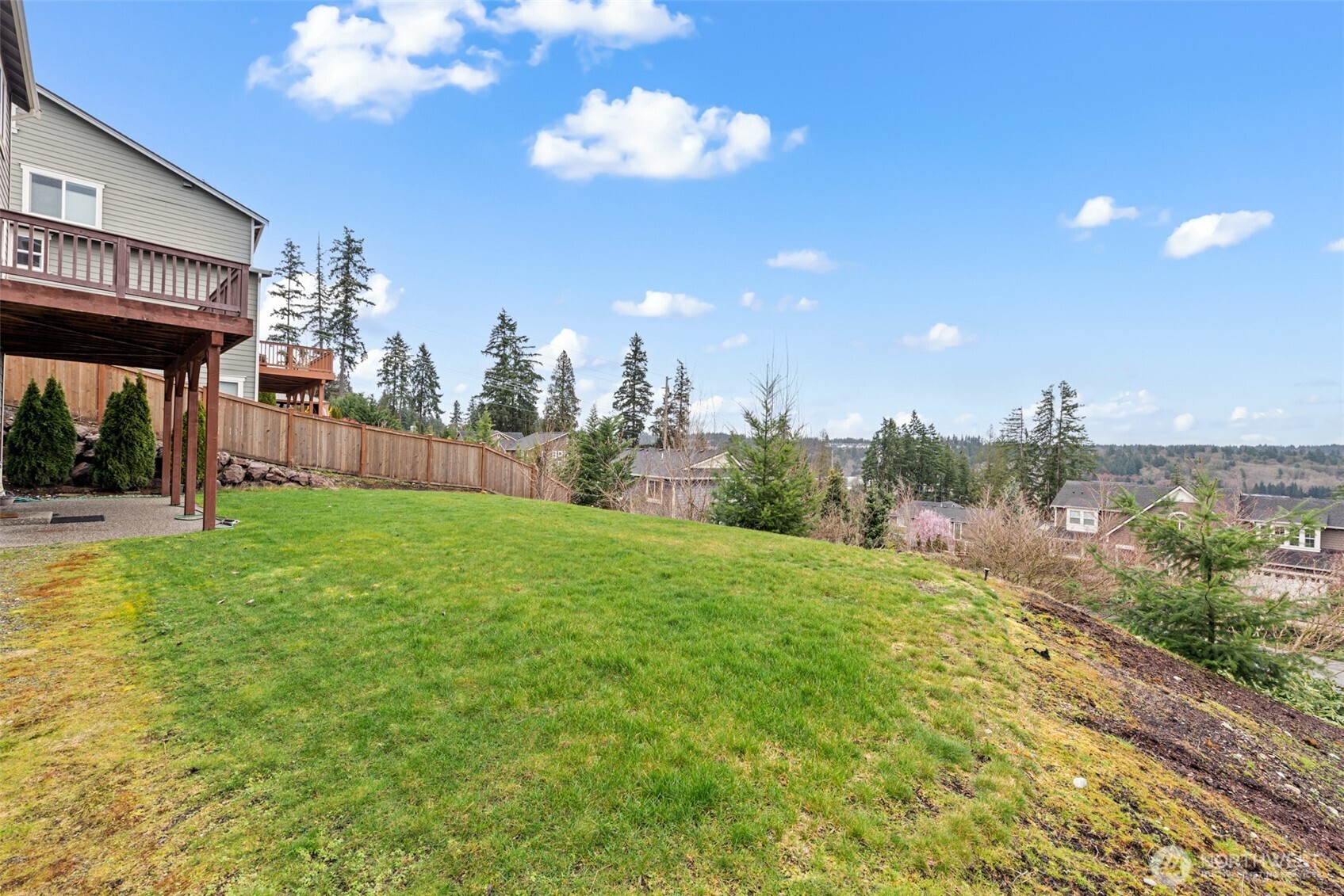 19420 109th Court Northeast Bothell, WA 98011 - Photo 30 of 35 a view of a fountain in front of a house with a big yard
