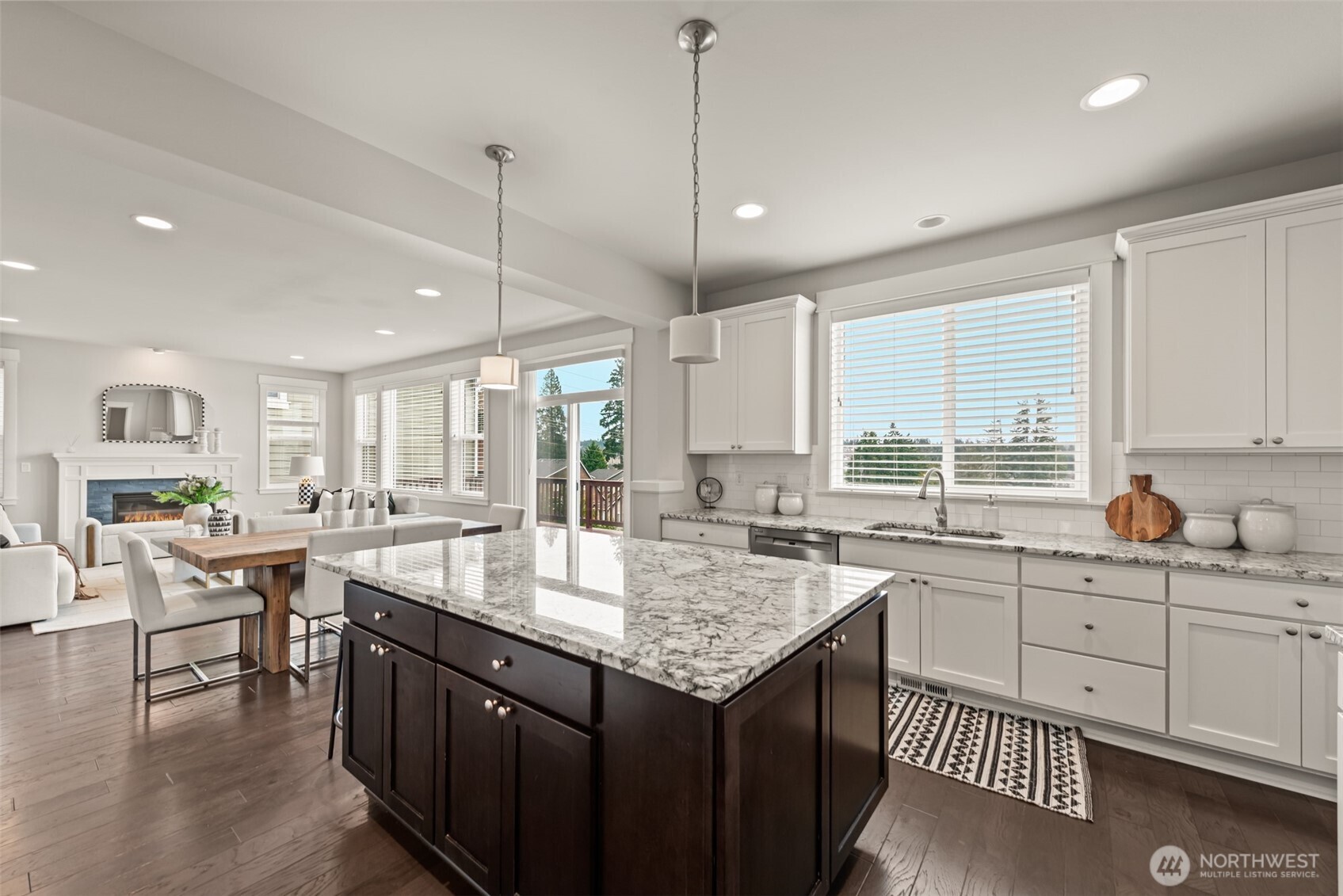 19420 109th Court Northeast Bothell, WA 98011 - Photo 7 of 35 a kitchen with lots of counter space windows and chairs