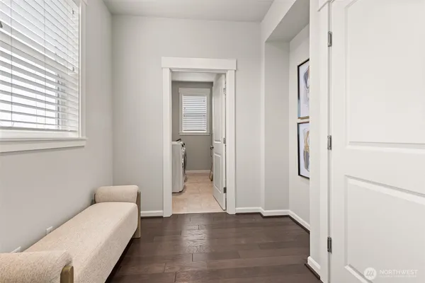 a living room with a couch and a walk in closet