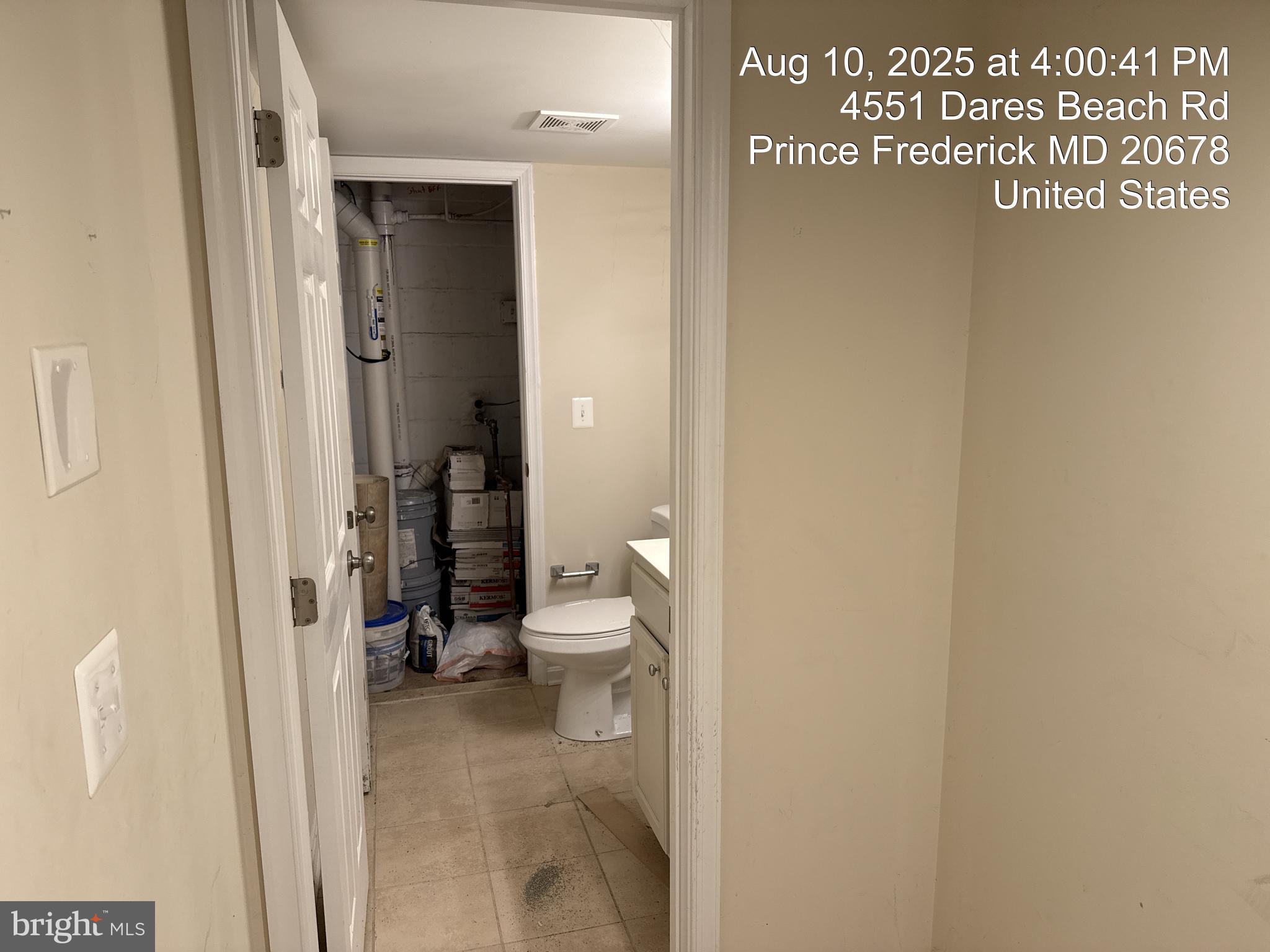 4551 Dares Beach Road Prince Frederick, MD 20678 - Photo 56 of 59 Basement Half Bath with Door to Water Tank