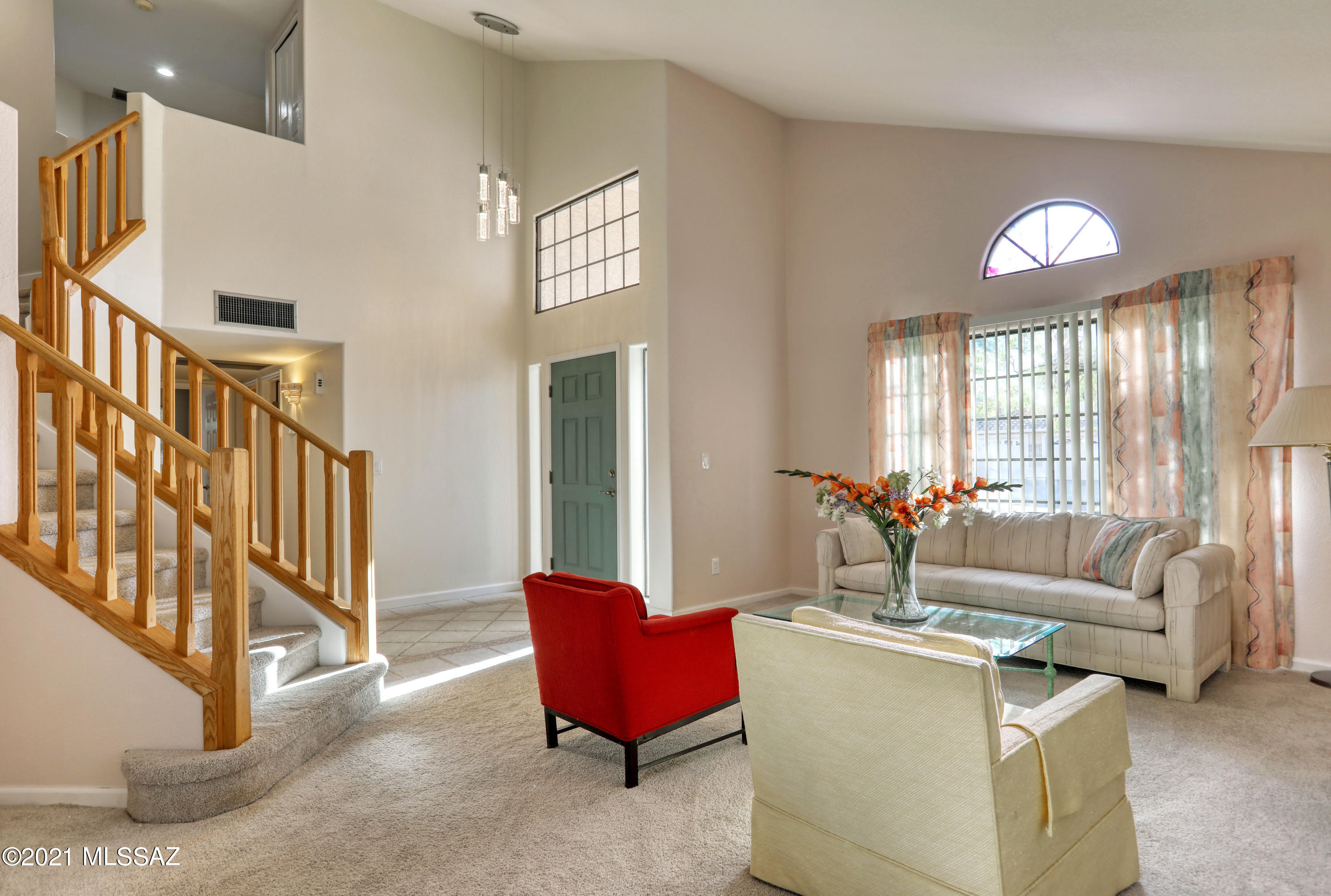 12560 North Wayfarer Way Oro Valley, AZ 85755 - Photo 5 of 43 a living room with furniture and a large window