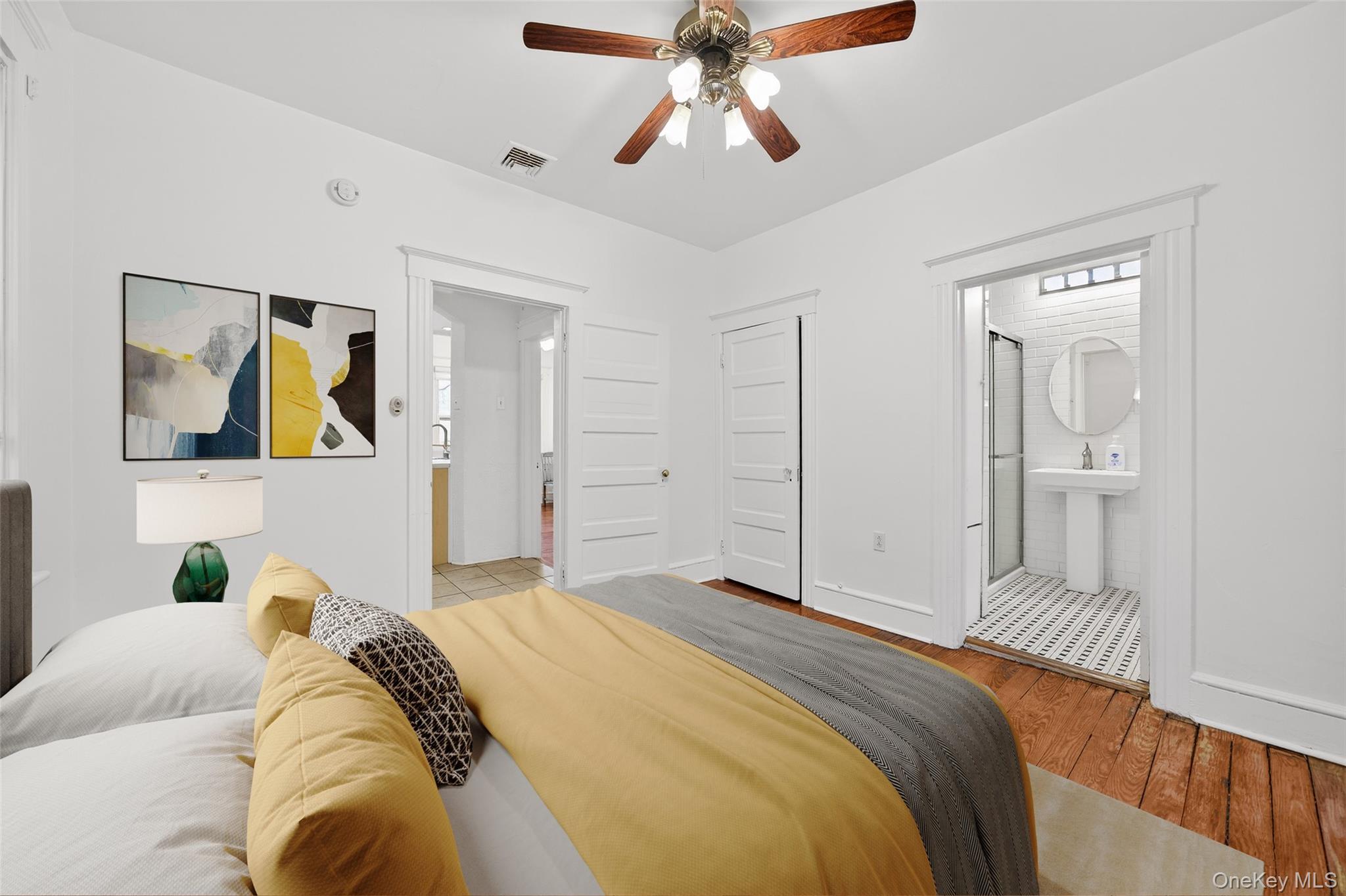 27 Algernon Street Cornwall, NY 12518 - Photo 19 of 41 a bedroom with a bed and a chandelier