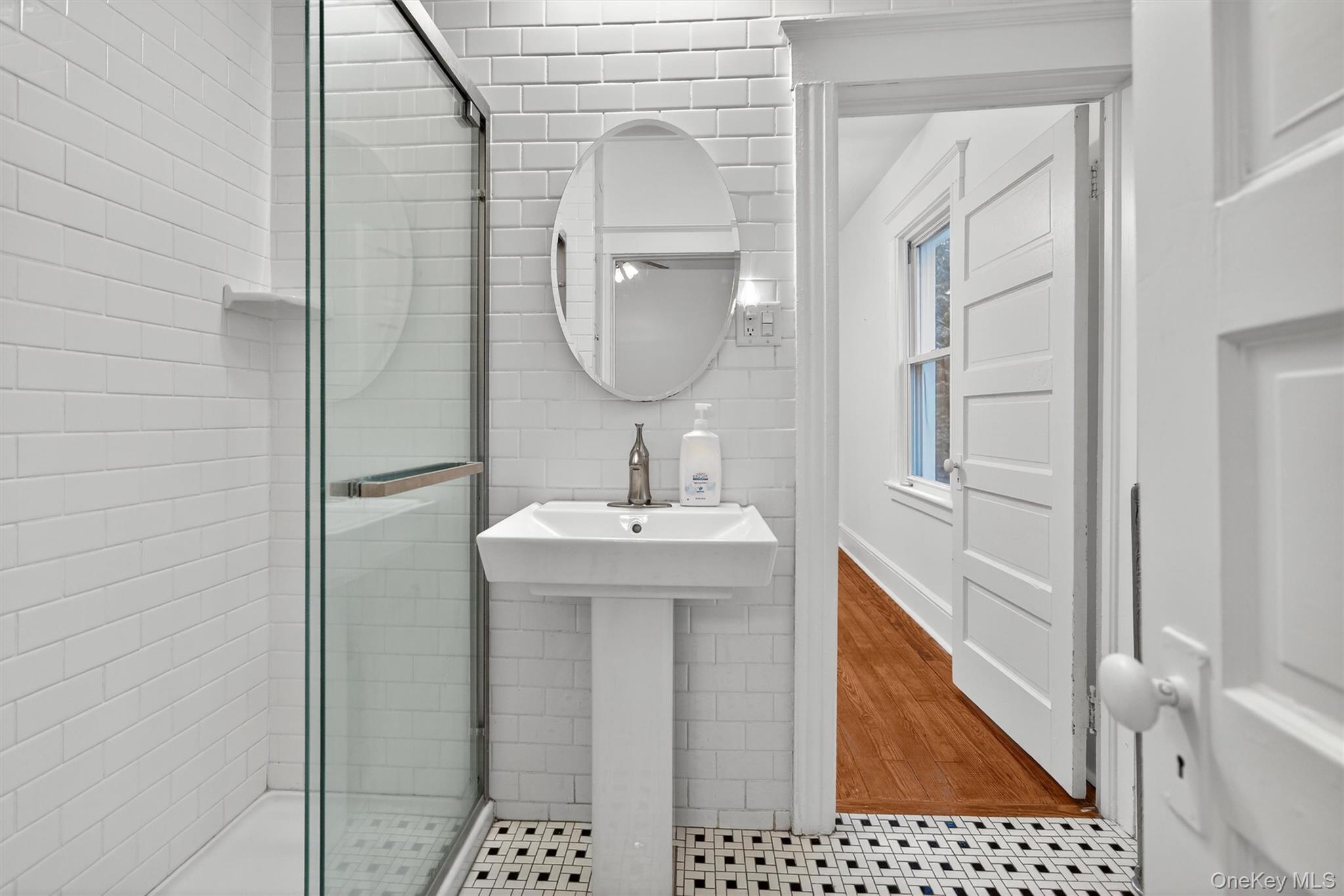 27 Algernon Street Cornwall, NY 12518 - Photo 21 of 41 a bathroom with a sink a mirror and a shower