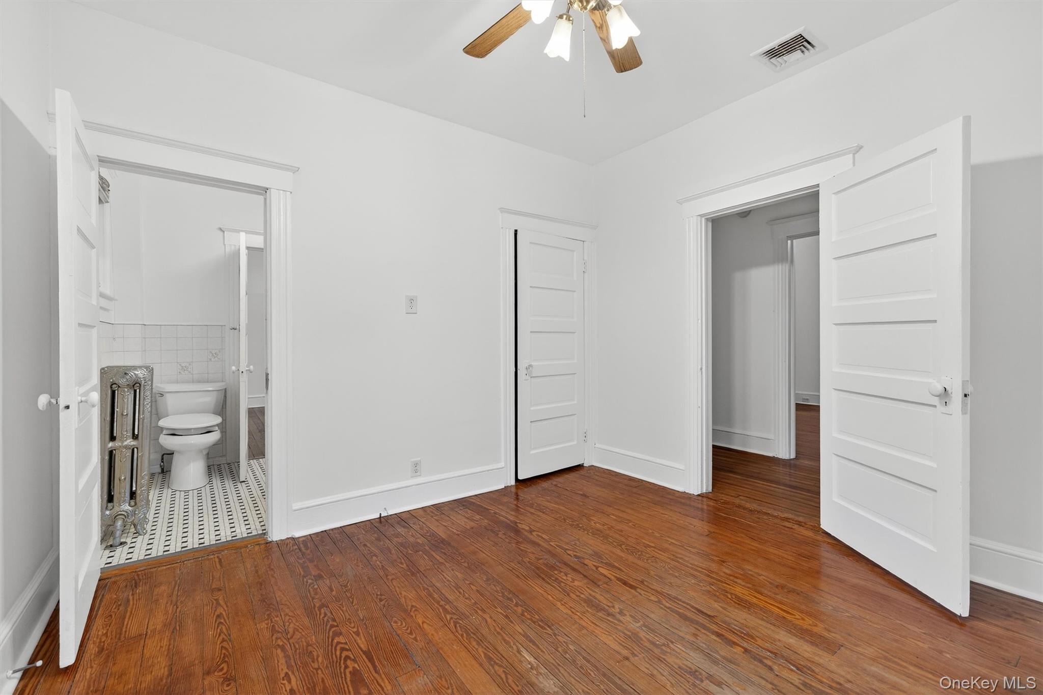 27 Algernon Street Cornwall, NY 12518 - Photo 22 of 41 wooden floor in an empty room with a window