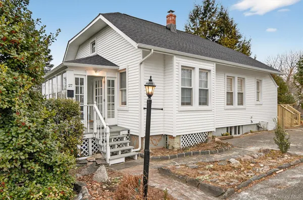 a front view of a house with a porch