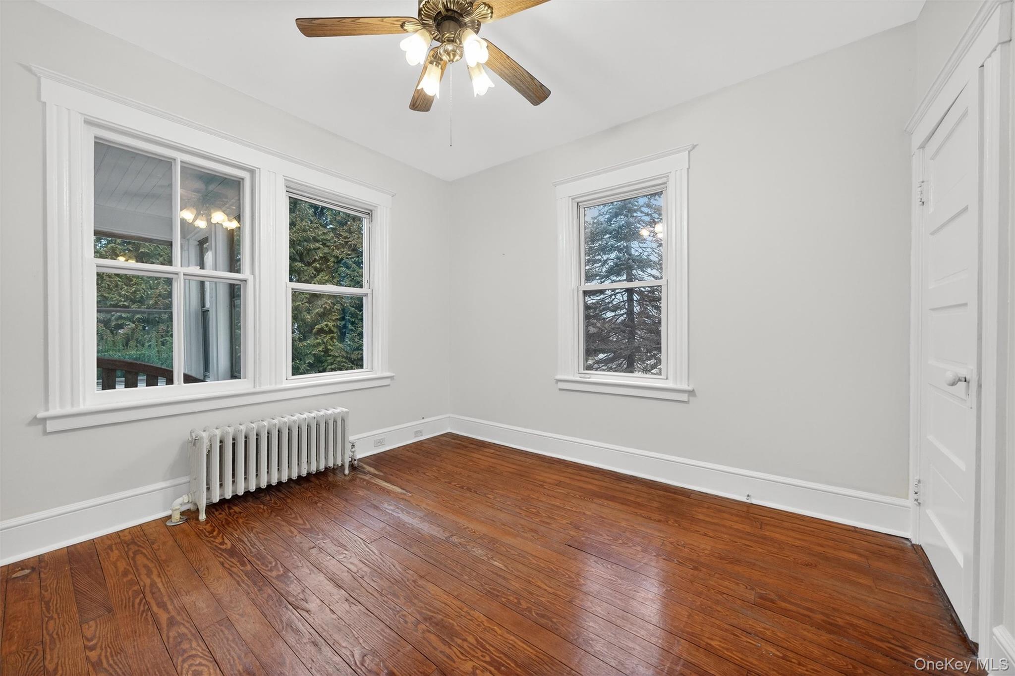 27 Algernon Street Cornwall, NY 12518 - Photo 7 of 41 a view of an empty room with wooden floor and a window
