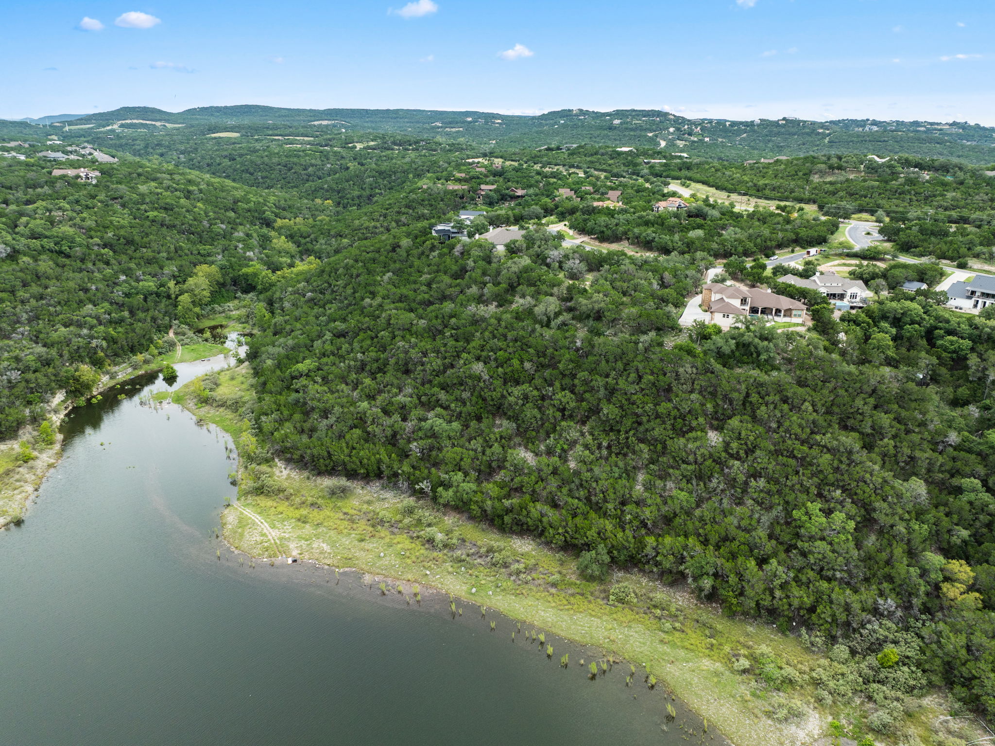 18821 Hidden Ridge Place Jonestown, TX 78645 - Photo 11 of 15 a view of a green field with an ocean view