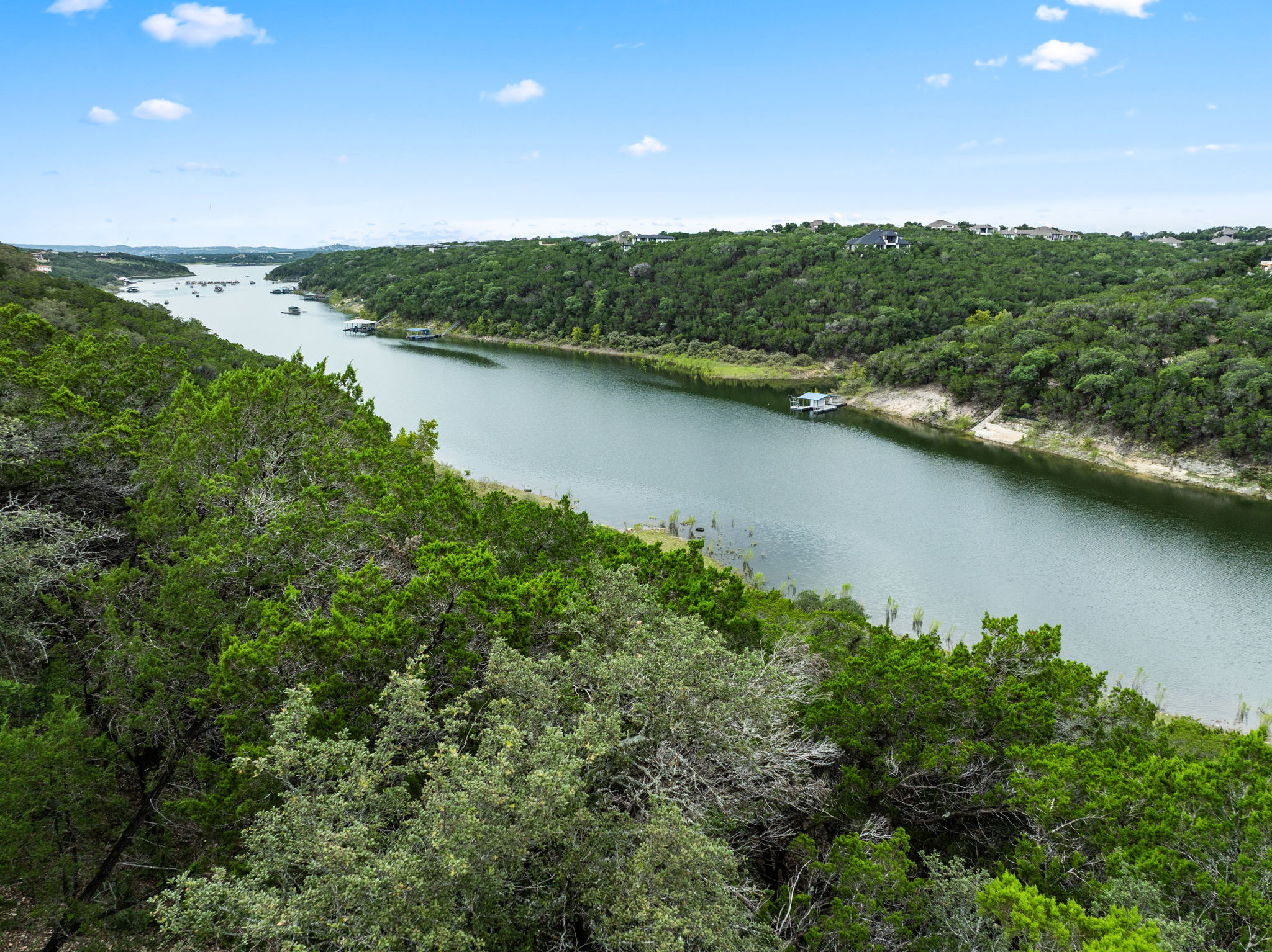 18821 Hidden Ridge Place Jonestown, TX 78645 - Photo 2 of 15 a view of a lake with a city view