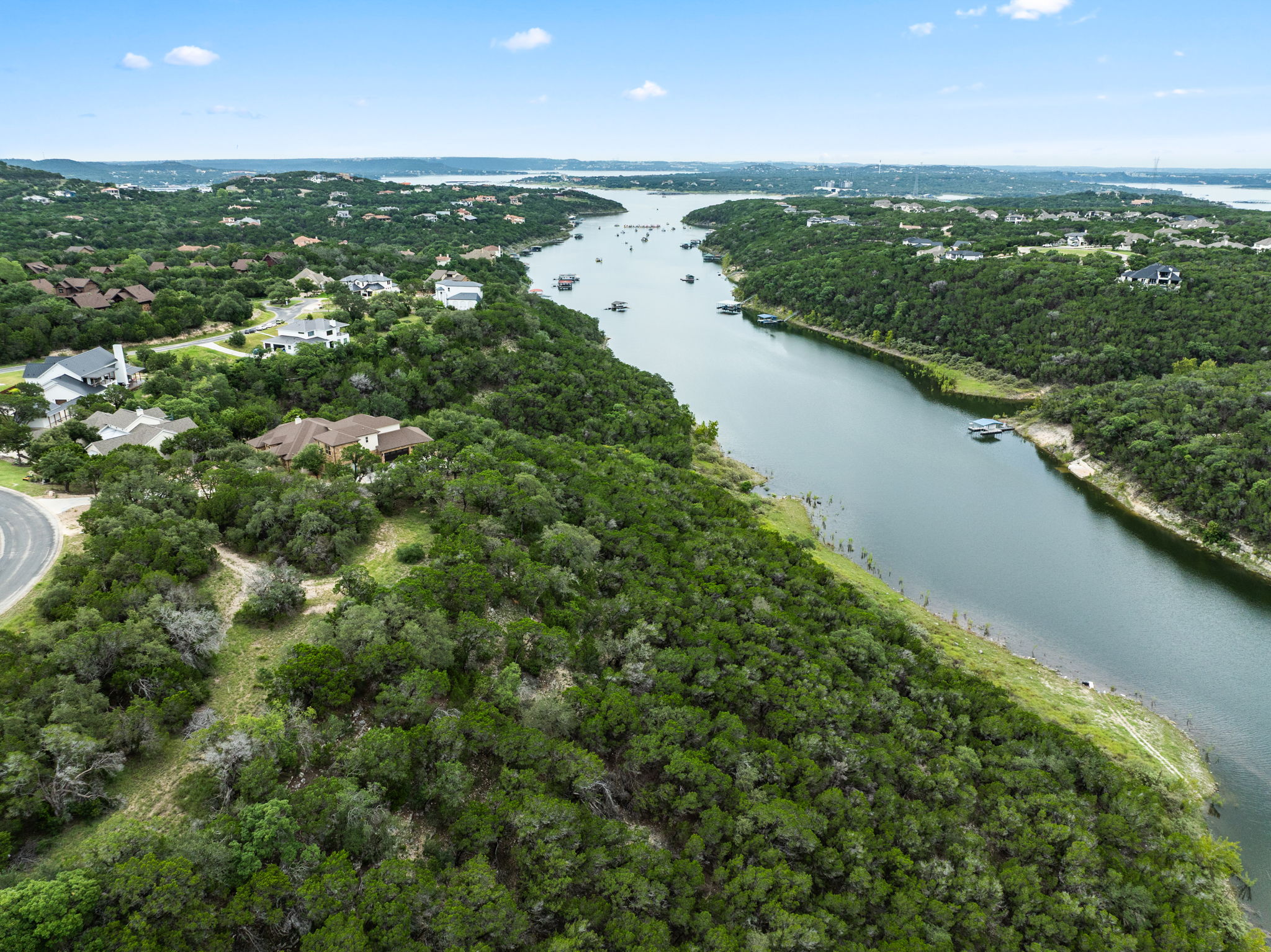 18821 Hidden Ridge Place Jonestown, TX 78645 - Photo 10 of 15 an aerial view of residential houses with outdoor space and river