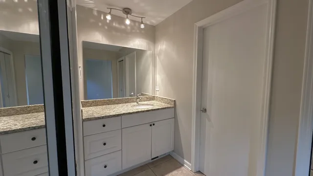 a white toilet sitting in a bathroom