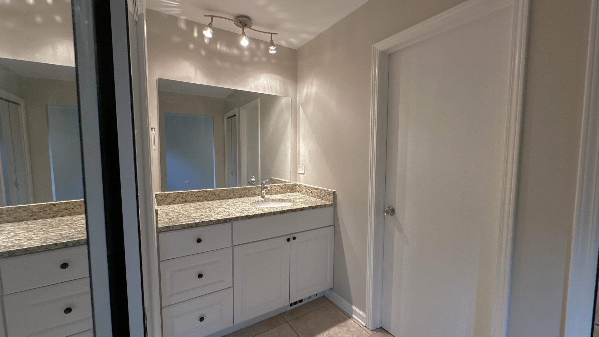 1607 Sylvan Court Flossmoor, IL 60422 - Photo 12 of 21 a bathroom with a granite countertop sink and a mirror