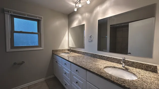 a white toilet sitting next to a bathtub