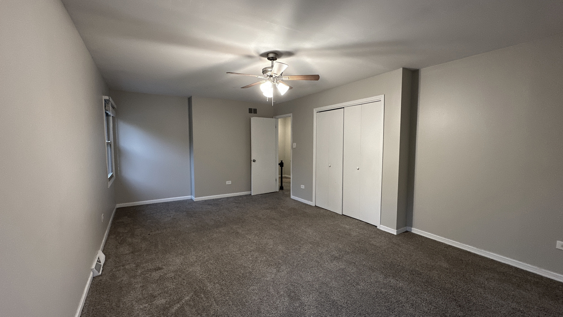 1607 Sylvan Court Flossmoor, IL 60422 - Photo 18 of 21 a view of an empty room with a ceiling fan